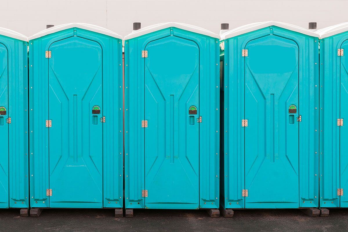 Industrial portable restroom units at a plant in Gallup, New Mexico
